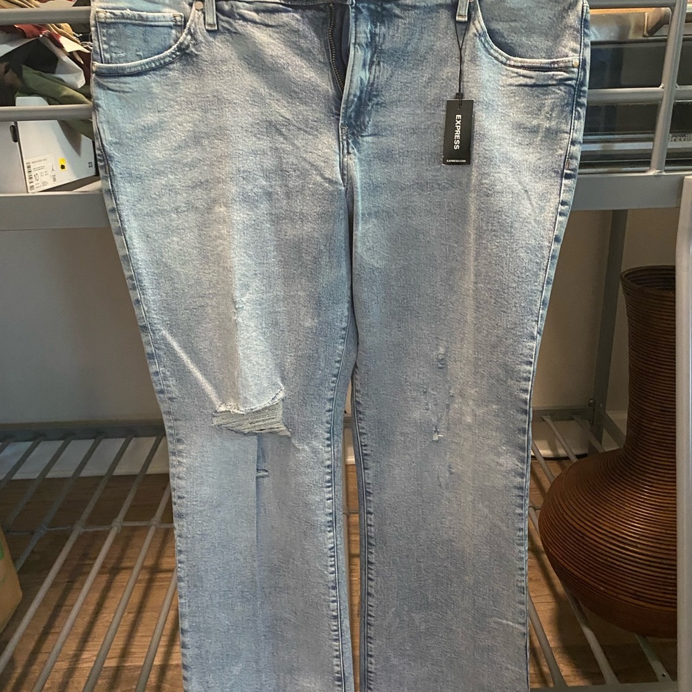 NWT. Express low waist boot cut distressed jeans.